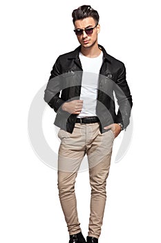 Fashion man posing with one hand in pocket