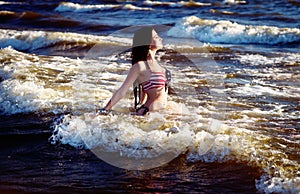 Fashion model in American flag bikini, swimwear relax on the beach. Luxury