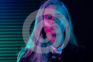 Fashion model blonde woman in colorful bright neon lights