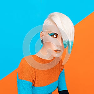 Fashion model with bright makeup and multi-coloured hair. Art ph