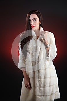 Fashion model in coat white mink