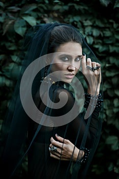Fashion model dressed in gothic style. Vamp.