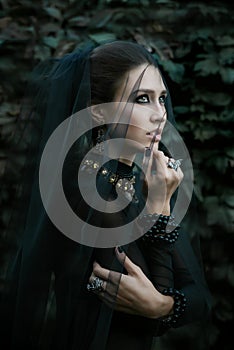 Fashion model dressed in gothic style. Vamp.