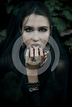 Fashion model dressed in gothic style. Vamp.