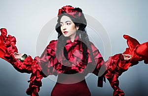Fashion model in elegance red costume