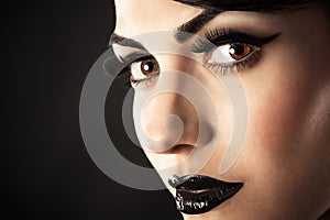 Fashion model face with black makeup