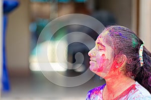 Fashion Model Girl colorful face paint. Beauty fashion art portrait of beautiful girl with powerder paint holi, abstract makeup.