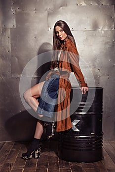 Fashion Model girl full length portrait in the brown coat with m