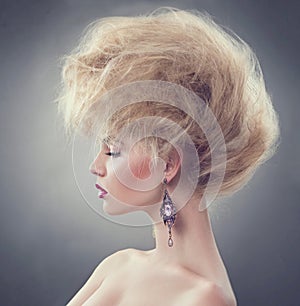 Fashion model girl with updo hairstyle