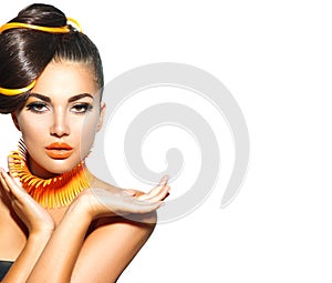 Fashion model girl with yellow and orange makeup