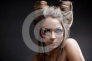 Fashion model with halloween makeup and hairstyle