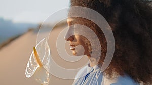 Fashion model holding flower at summer desert close up. Woman posing with calla