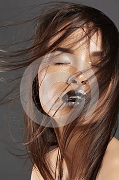 Fashion Model with Long Blowing Hair. Glamour Asian Beautiful Woman with Beautiful Brown Hair. Fashion Style, Clean Skin