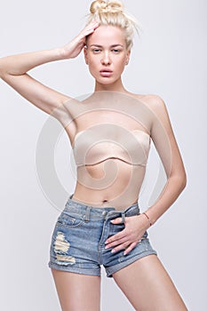 fashion model with long hair, young European attractive, beautiful eyes, full lips, perfect skin is posing in studio for gla