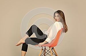 Fashion model looking casual. Stay home. Summer makeup. Girl sit on chair. Girl with natural makeup. Woman sensual look