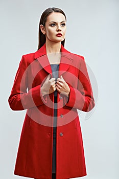 Fashion model portrait in catalog clothes style in red coat wit