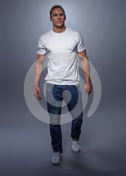 Fashion model posing in jeans and white t-shirt