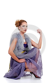 Fashion model with purple dress fur vest