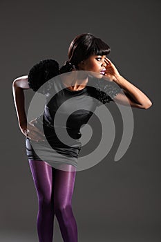 fashion model in purple tights black dress