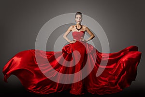 Fashion Model Red Dress, Woman in Long Fluttering Waving Gown, Beauty Portrait photo