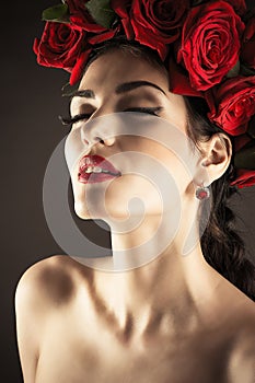 Fashion model with red roses hairstyle