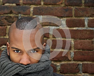 Fashion model with scarf covering face