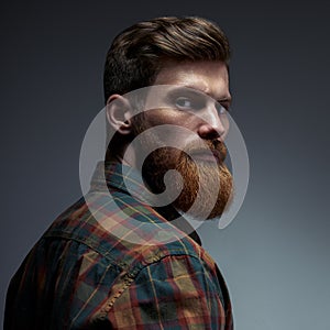 Portrait of a man with beard and modern hairstyle photo