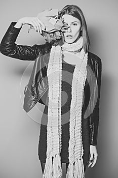 Fashion model with stylish hair in scarf.