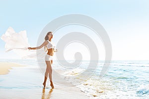 Fashion Model on Sunny Sea Beach, Woman in White Sexy Sport Clothing, Cloth Fluttering on Wind