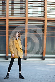 Fashion model walking and posing outdoor. Young blond caucasian woman posing winter outdoo.