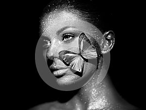 Fashion model woman with blue butterfly