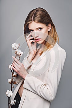 Fashion model woman with cotton plant balls in her