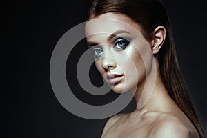 Fashion model Woman with fantasy make up. Long blowing brown hair.