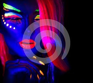 Fashion model woman in neon light