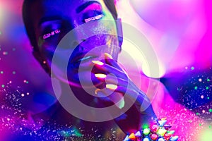 Fashion model woman in neon light