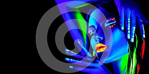 Fashion model woman in neon light, portrait of beautiful model girl with fluorescent makeup, Body art design in UV