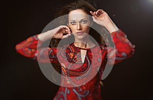 Fashion model woman in red bright dress