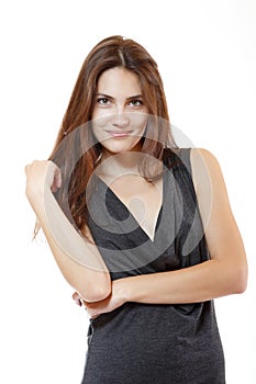 Fashion model. Young woman posing in studio. Beautiful caucasian smiling girl over white background