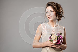 Fashion Models Beauty Portrait with Flowers Bouquet, Beautiful Woman Bridal Makeup and Hairstyle, Girl studio shot on gray