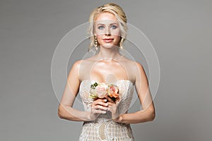 Fashion Models Beauty Portrait with Flowers Bouquet, Beautiful Woman Makeup and Hairstyle, Girl studio shot on gray