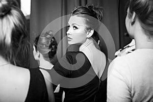 fashion models prepared for runway by stylish designer. Black and white photography photo