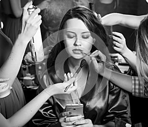 Fashion models prepared for runway by stylish designer. Black and white photography