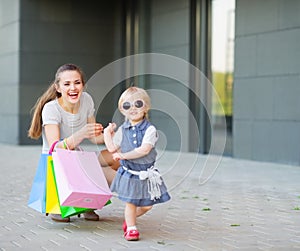 Fashion-monger baby on shopping with mom photo