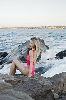 Fashion outdoor photo of gorgeous woman with blond hair in elegant bikini