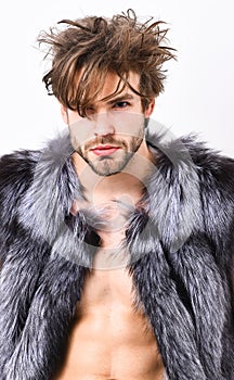 Fashion and pathos. Richness and luxury lifestyle. sleepy rich macho tousled hair fur vest on white background. Guy