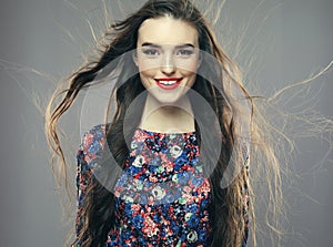 Fashion and people concept: Beautiful happy female with long wavy hair