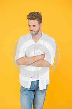 Fashion and people concept. Sexy and handsome. Confident young handsome man in jeans shirt. guy wearing jeans and t