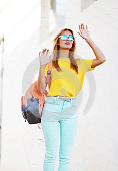 Fashion and people concept - stylish pretty blonde in sunglasses