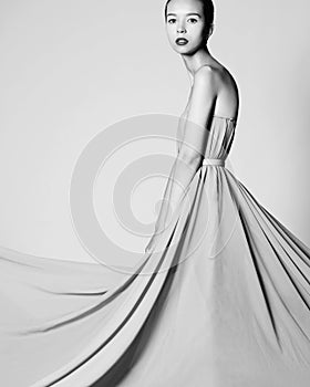 Fashion photo of beautiful asian woman in white dress