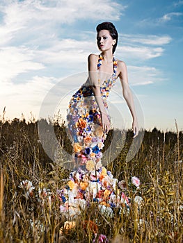 Fashion photo of beautiful lady in dress of flowers